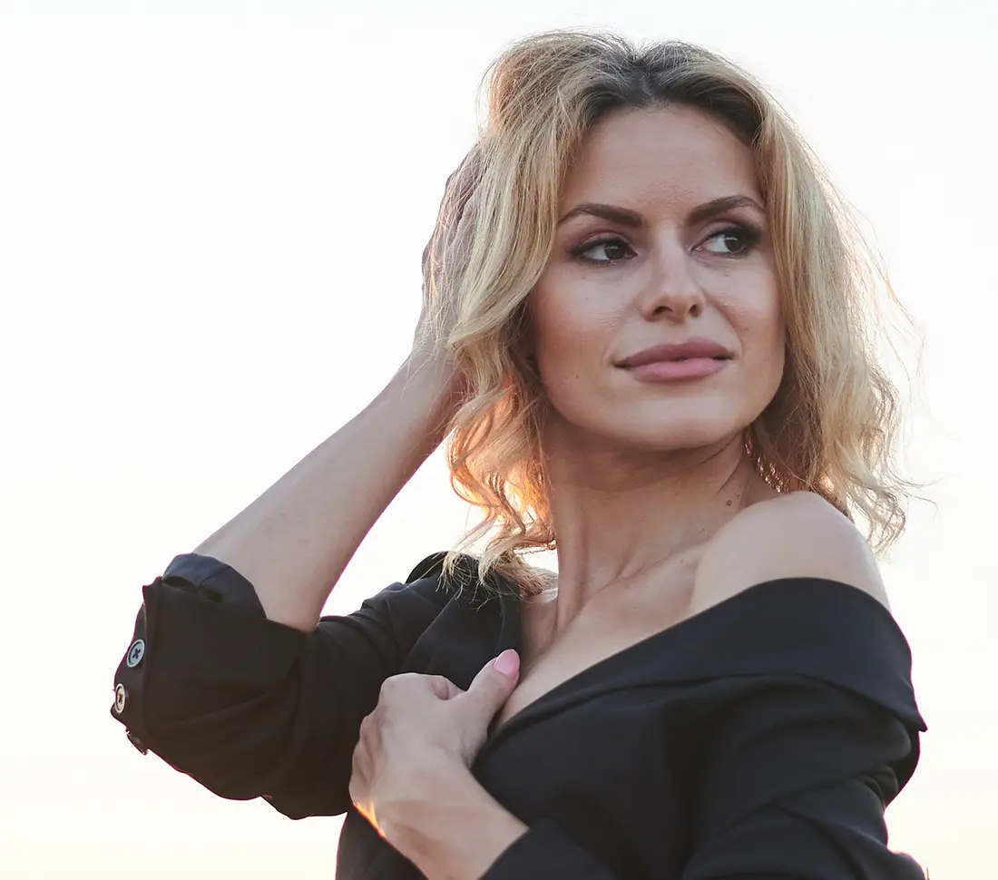 Touching hair | Hydrafacial | Aesthetica Med Spa In Austin, TX